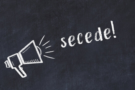 Chalk loudspeaker and inscription secede on black chalkboard