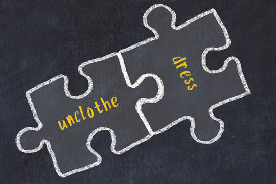 Chalk drawing of two puzzles with words unclothe and dress