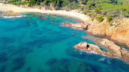aerial view of a bay with a sandy beach and crystal clear turquoise water and rocks, vacation, summer vacation, tourism, Costa Brava, Spain, Mediterranean, Europe