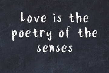 Chalk inscription of smart quote on black desk © iushakovsky