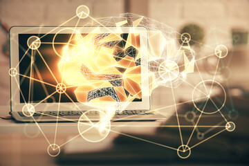 Double exposure of work space with computer and human brain drawing hologram. Brainstorm concept.