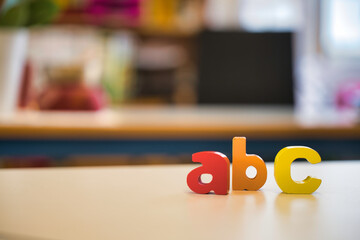 wooden alphabet blocks basic class classroom colourful educational studying teacher three writing...