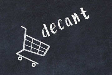 Chalk drawing of shopping cart and word decant on black chalboard. Concept of globalization and mass consuming