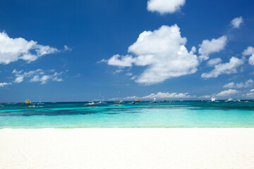 Fototapeta na wymiar Pristine beach with white sand and turquoise tropical sea. Travel destination