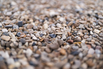 Boulder pebble beach stones background seamless texture for design use. Naturally rounded gravel at river. Nature background texture pattern