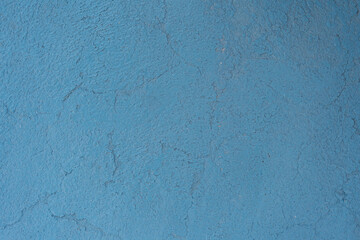 Abstract grunge decorative light blue painted stucco wall texture.