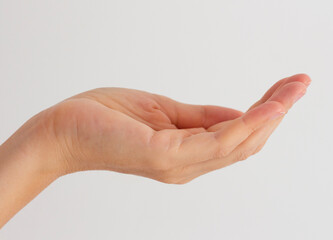 Female hand palm. Gesture to ask or give. Body skin care, cosmetics. Beauty and health. Template with empty space. Photo closeup