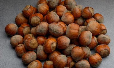 beautiful hazelnuts on a gray background close-up