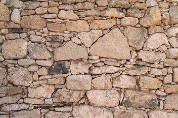 Real stone wall surface with cement. Braun pattern, modern style design, decorative stones