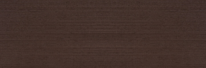 Texture of wenge wood. Dark brown wenge background. Natural brown wood texture, solid natural wood...