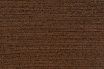 Texture of wenge wood. Dark brown wood for furniture or flooring. Close-up of a Wenge wooden plank,...