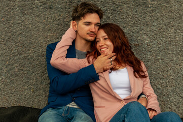 Beautiful young couple in love dating outdoors  - obrazy, fototapety, plakaty