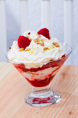 Cranahan - tasty Scottish dessert of whipped cream and fried oat flakes with whiskey, honey and raspberries