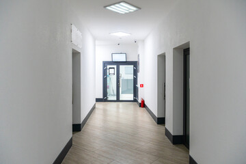 A corridor in an urban-type office building. Modern interior of the lobby of an office building...
