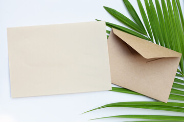 Brown paper and envelopes on green leaves
