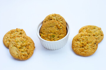 pistachio and almond cookies on white background.