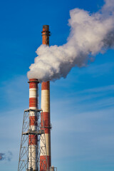 smoking chimneys on the blue sky