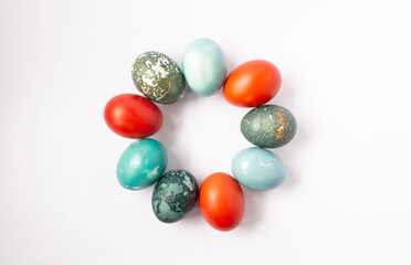 Colorful Easter eggs and burning wax candle. Traditional festive decor.