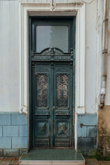 Vintage wooden green door of old mansion