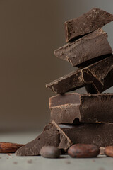 mound of dark chocolate on a gray background