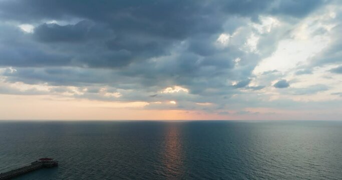 Sunset over sea horizon Cinematic scene seascape sunset Cloud sunset background Aerial high angle view, High quality footage 4K ProRes 422HQ