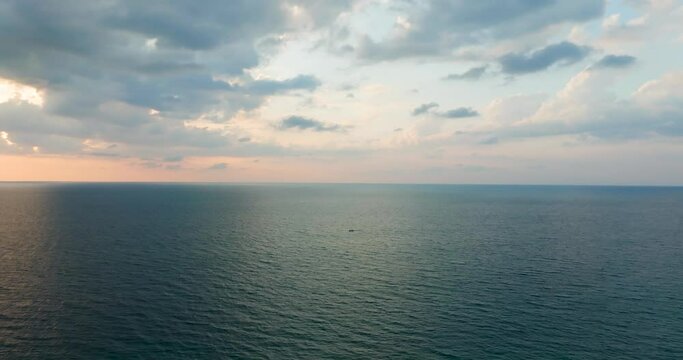 Sunset over sea horizon Cinematic scene seascape sunset Cloud sunset background Aerial high angle view, High quality footage 4K ProRes 422HQ