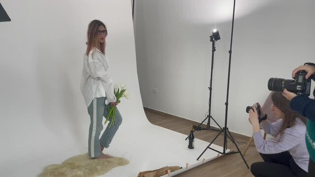 Female portrait photo shoot backstage in studio. High quality FullHD footage