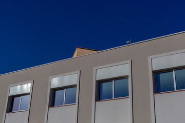 Modern building over the blue sky background