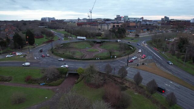 High Angle Footage of British Roads and Traffic During Sunset. Beautiful Traffic View at Central Milton Keynes City of England UK. High Angle Footage with Drone on 27-01-2023 During Sunset and Cloudy 