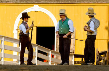 Playing their part in the living museum recreating colonial life in New England, participants of Old Sturbridge Village in Sturbridge, Mass play their roles dressed in period garb.