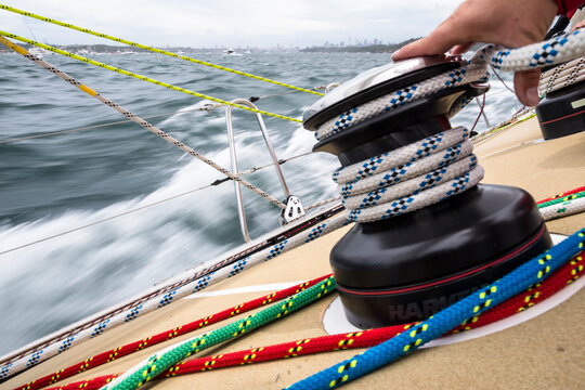 Sailor easing the sheet during the start of the 2015 Sydney to Hobart yacht race.