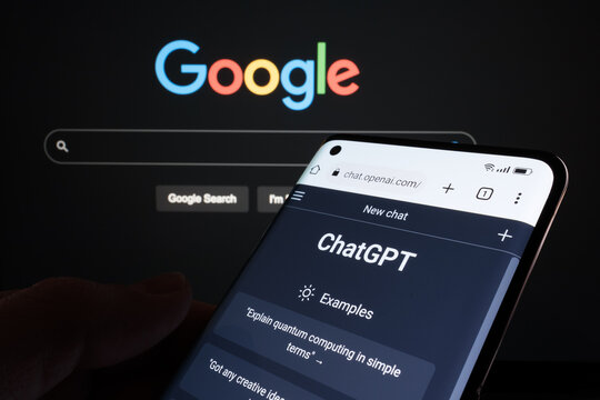 ChatGPT chat bot page seen on smartphone and laptop display with blurred GOOGLE search page. AI chatbot vs search engine. Concept. Stafford, United Kingdom, January 29, 2023