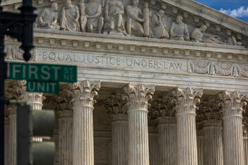 Fototapeta na wymiar Partial View of the United States Supreme Court Building with Street Sign 