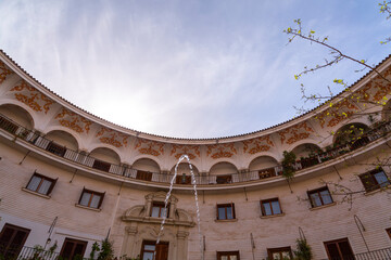 The Plaza del Cabildo is located in the Arenal neighborhood of Seville, Spain