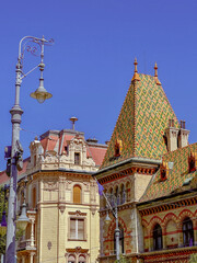 Budapest Fovam Ter Square, City Market Place, is at the Danube in the downtown old area. See the beautiful roof lines of the buildings and a light post. Tourist spot.