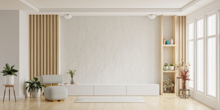 Mockup a cabinet TV wall mounted with armchair in living room with a white cement wall.