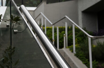 Outdoor staircase with metal handrails on city street, closeup