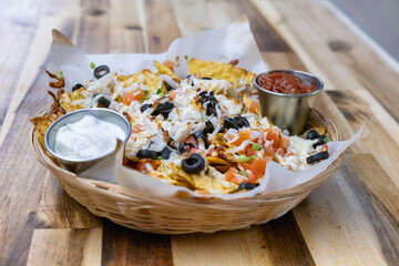 Plate of nachos in restaurant kitchen