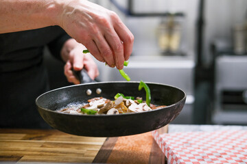 Chef preparing food in restaurant kitchen 