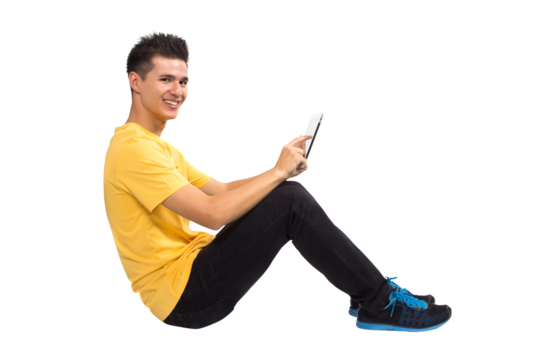 Full body Teenage boy portrait sitting using tablet computer - Powered by Adobe