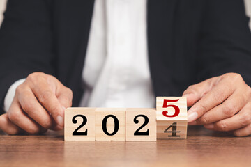 Flipping of 2024 to 2025 on wooden cubes for preparation of new year change