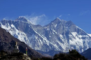 Photo sur Plexiglas Lhotse In Tengboche, Nepal, an awe-inspiring sight unfolds as the towering giants of Mt. Everest and Mt. Lhotse dwarf a diminutive stupa in their magnificent shadow..