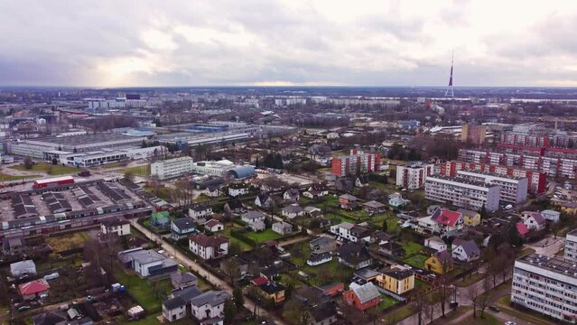 Private estates, apartment and industrial buildings in Riga suburbs, aerial view