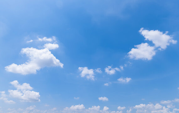 Panoramic view of clear blue sky and clouds, Blue sky background with tiny clouds. White fluffy clouds in the blue sky.

