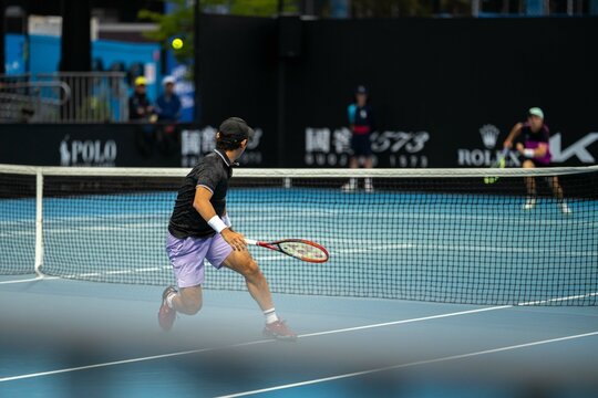 Tennis player playing on a court in a tennis tournament in summer
