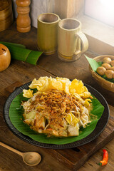 Indonesian traditional food, namely ketoprak and lontong sayur for breakfast with the darkmood photo concept