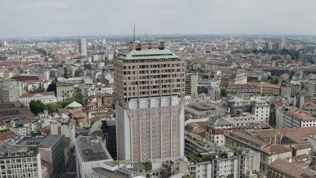 Torre Velasca tower surrounded by Milan cityscape, aerial view