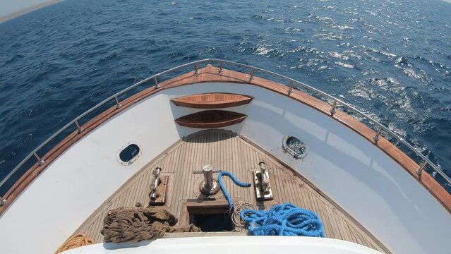 Front deck of a luxury yacht ship sailing, travel concept background