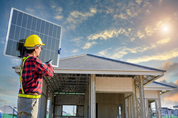 solar panels installed on the roofs of houses and industrial buildings Professional engineer working on construction site