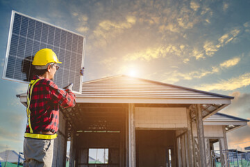 Male engineer holding solar panels and installing solar panels at home and industrial building design project solar energy storage